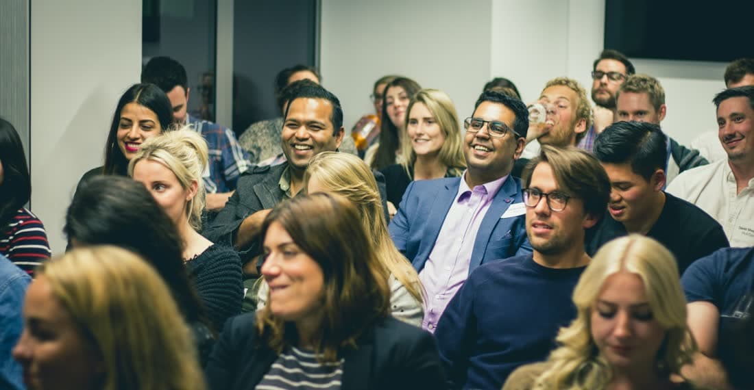 An audience laughing during a session